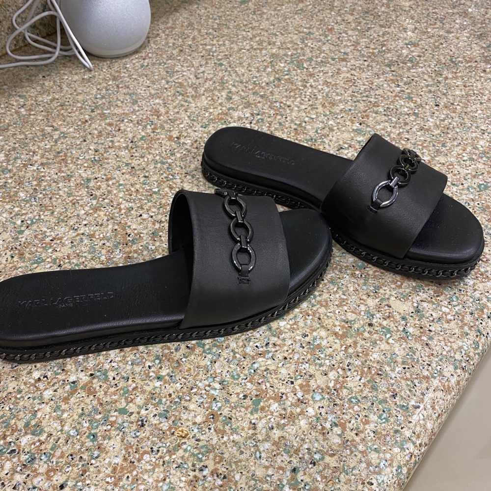 Black leather slides by Karl Lagerfeld